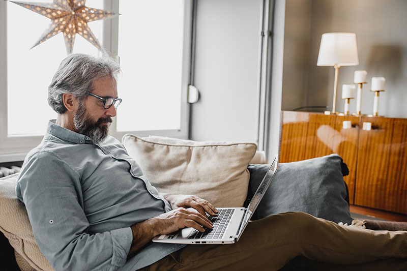 Mature man is working from home